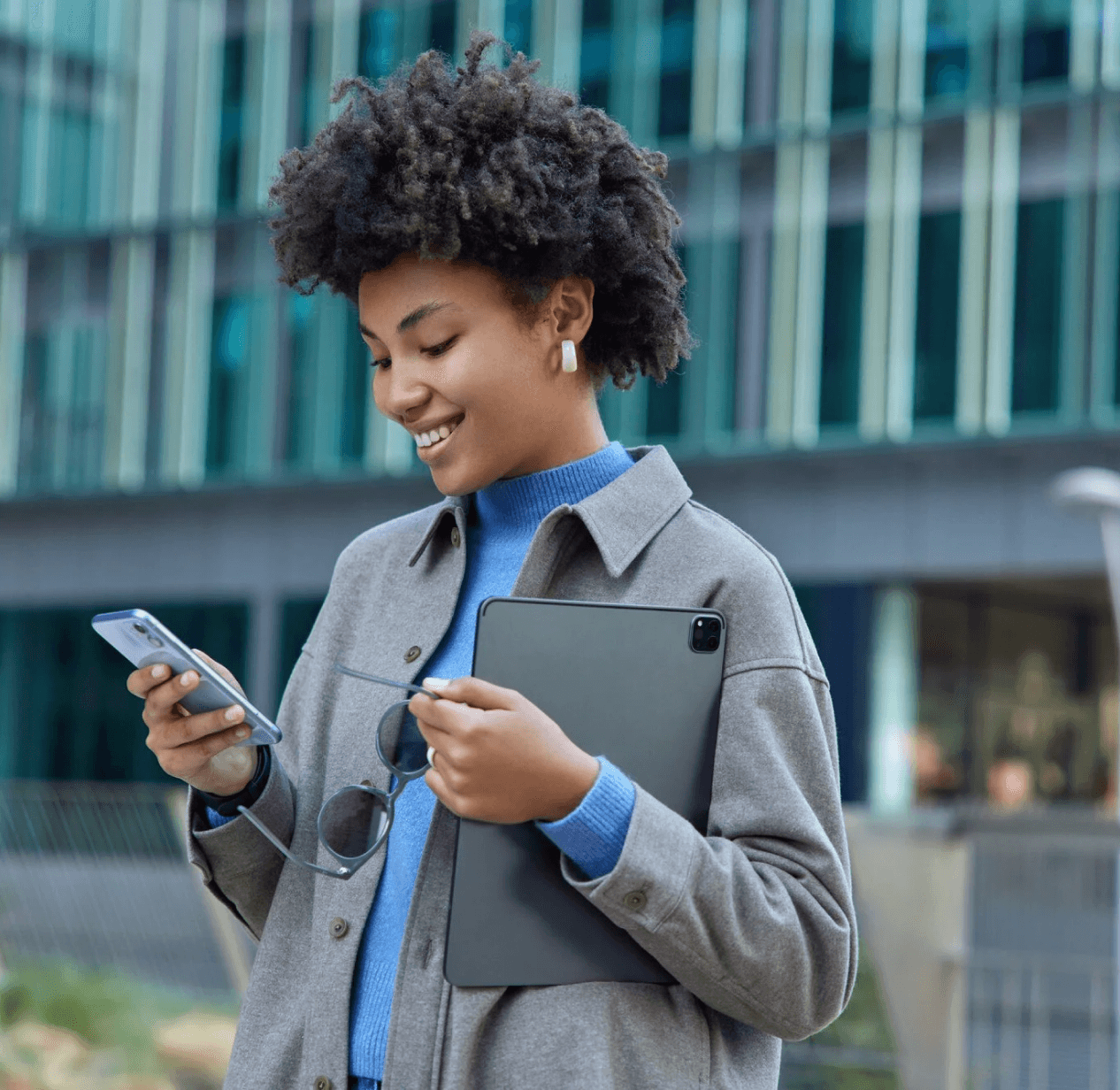 Woman Smiling While going through her phone